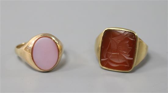 A 9ct gold and carnelian set intaglio ring and a 9ct gold and carnelian set oval signet ring.